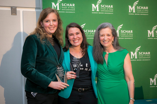 Danielle Melton (left) and Rebecca Dooley (center) receive their GAP Leadership Award from Professor Bonnie Stabile. Photo: John Boal